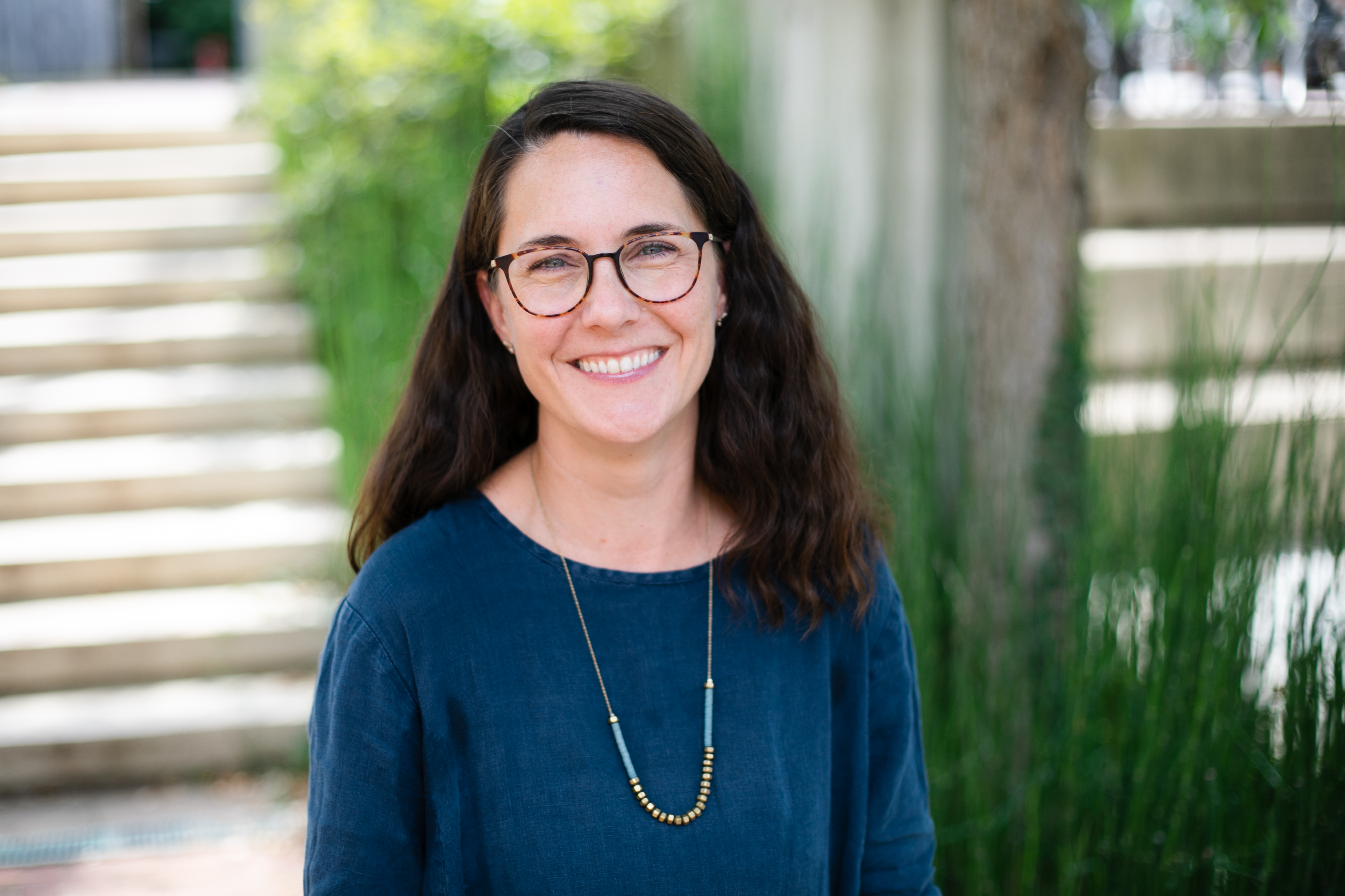 An image of Barbara Brown Wilson looking at the camera, wearing a blue shirt