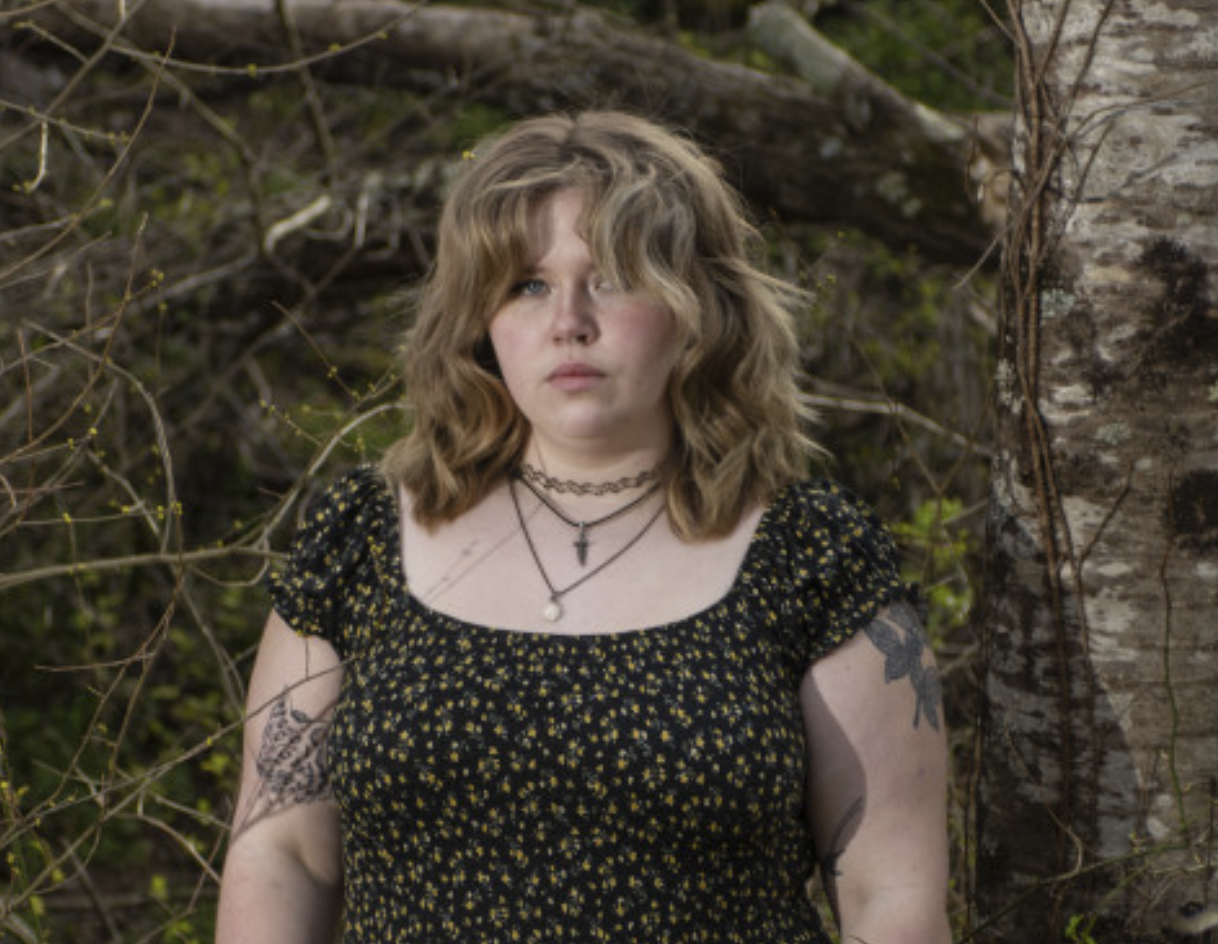 A headshot of a girl looking at a camera