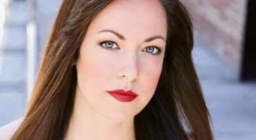 Assistant Professor and composer Leah Reid looks at the camera. 