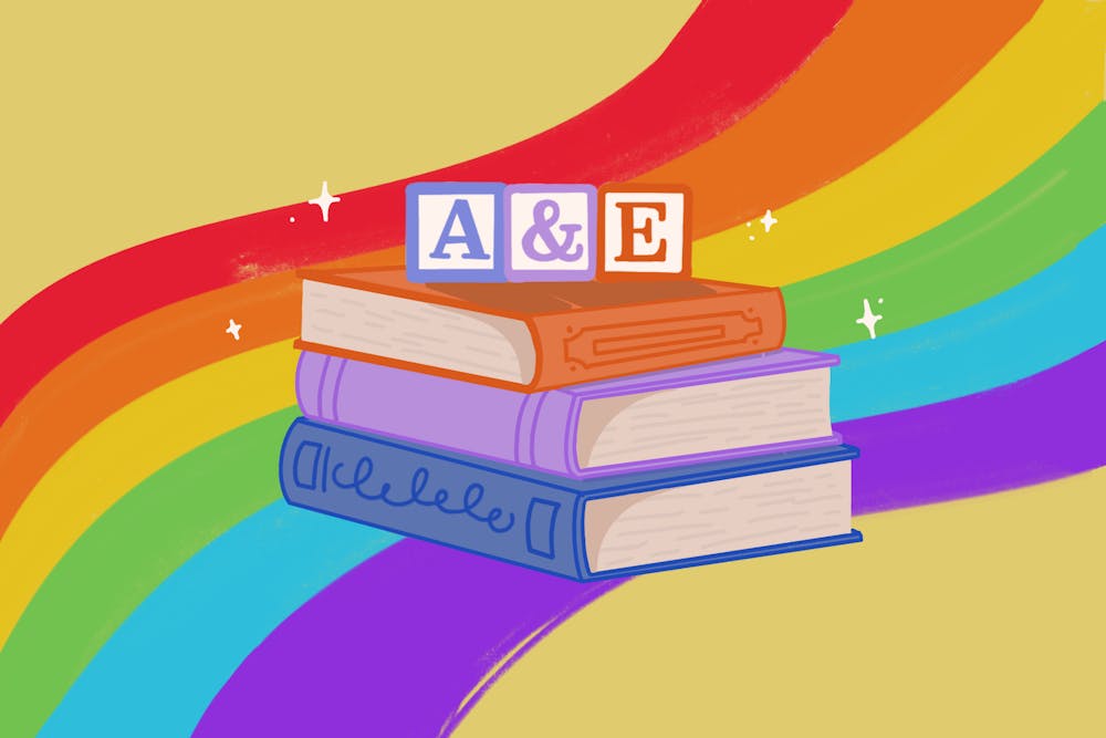 A rainbow background with a stack of three cartoon books in the center. Three blocks with the phrase "A & E" are on top of the books. 