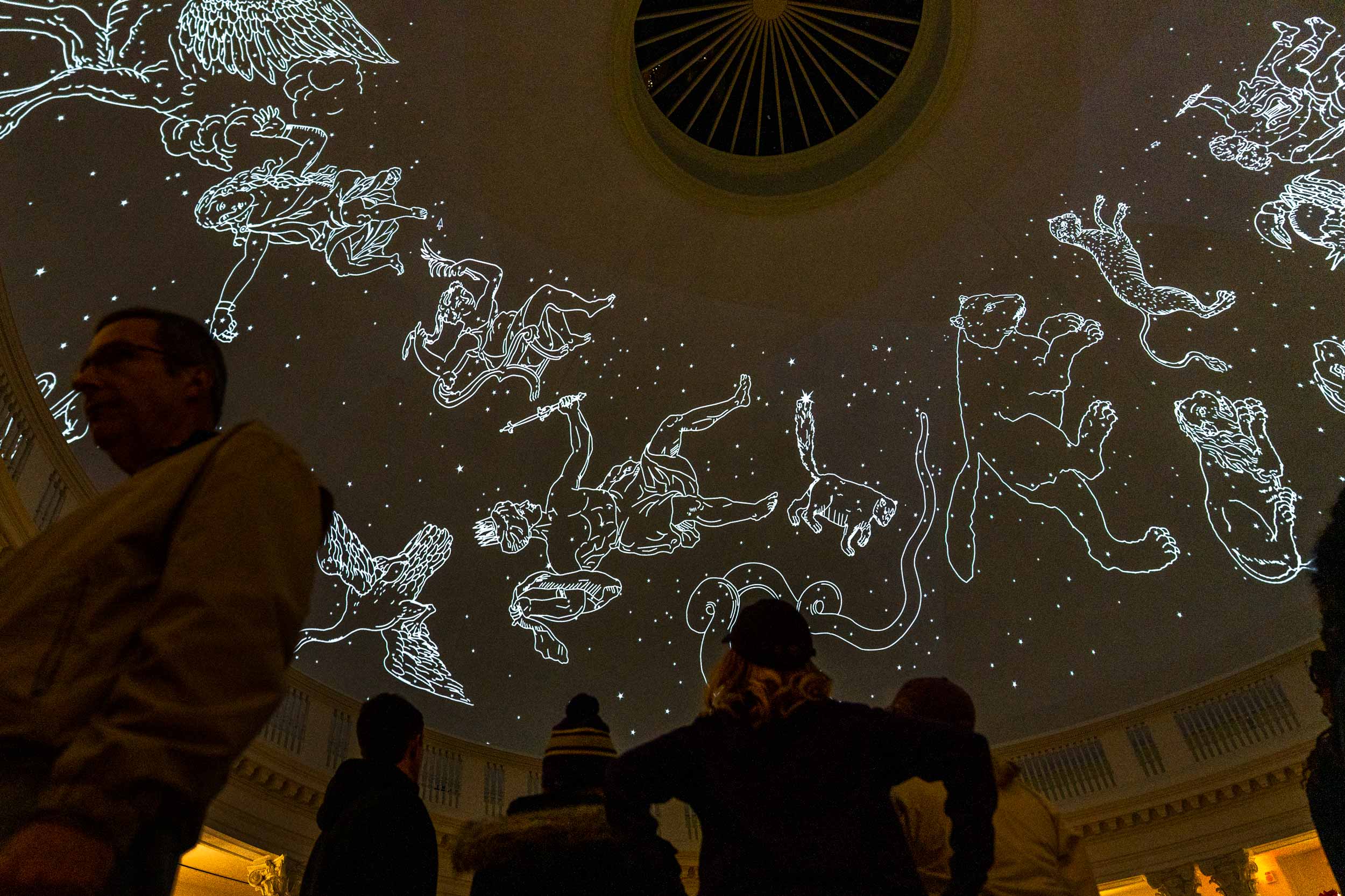 The inside ceiling dome of the Rotunda with projections of constellations in white light.