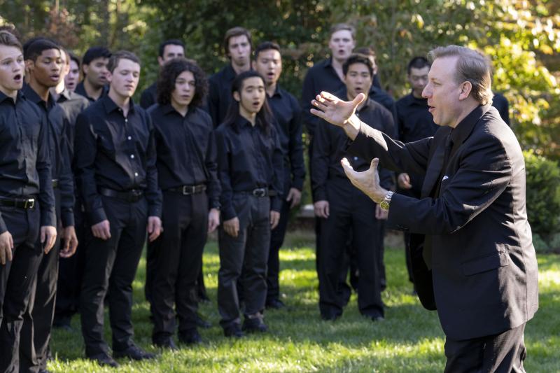 The University Singers warming up for their performance at Arts on the Hill at Carr’s Hill. (Photo by Dan Addison, University Communications)