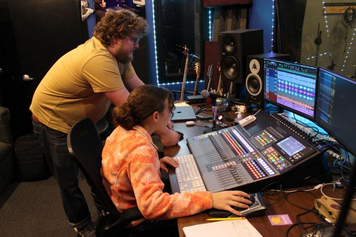 Music Resource Center (MRC): two people at a music mixing station